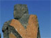 zwei sitzende Großskulpturen aus Basalt